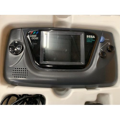 394 - A BOXED PORTABLE HAND HELD SEGA GAME + GEAR (INCLUDES ADAPTER)