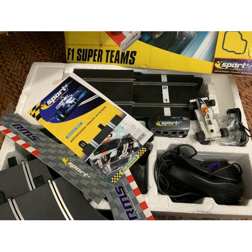 430 - A BOXED F1 SUPER TEAMS SCALEXTRIC TRACK AND CARS