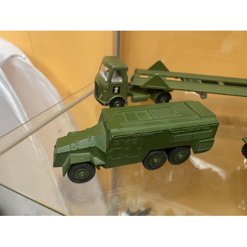 484 - THREE UNBOXED DINKY MODEL MILITARY VEHICLES - A CENTURIAN, AN ARMOURED COMMAND VEHICLE AND A TANK TR... 