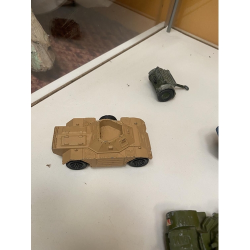 486 - SEVEN UNBOXED DINKY MODEL MILITARY VEHICLES - FOUR ARMOURED CARS, FIELD GUN ETC