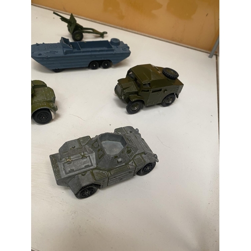 486 - SEVEN UNBOXED DINKY MODEL MILITARY VEHICLES - FOUR ARMOURED CARS, FIELD GUN ETC