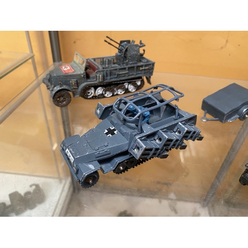 493 - FOUR UNBOXED CORGI MODEL MILITARY VEHICLES - A HANOMAG ROCKET LAUNCHER, A QUAD GUN TRACTOR, AN SD,KI... 