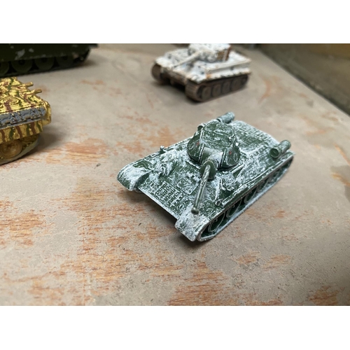 494 - FOUR UNBOXED CORGI MODEL TANKS - A PANTHER, A T34, A CHIEFTAIN AND A TIGER