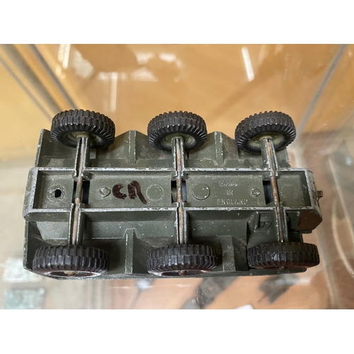 497 - THREE UNBOXED DINKY MODEL MILITARY VEHICLES - AN ARMOURED CAR AND TWO FIELD GUNS