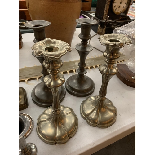 100 - A COLLECTION OF SILVER PLATED AND PEWTER CANDLESTICKS