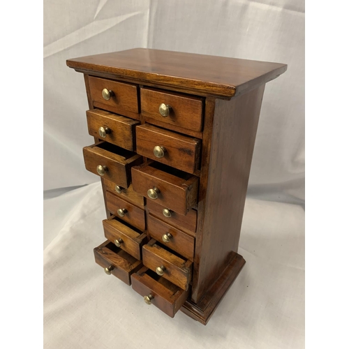 11 - A MINIATURE MAHOGANY FOURTEEN DRAWER CABINET H:32CM