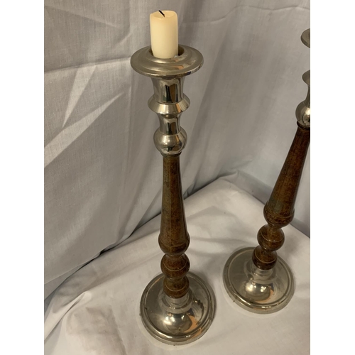 25 - A PAIR OF TALL METAL CANDLESTICKS H:47CM HIGH