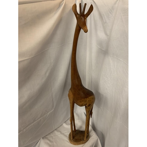 44A - A TALL WOODEN GIRAFFE (REPAIR TO FOOT)