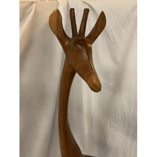 44A - A TALL WOODEN GIRAFFE (REPAIR TO FOOT)