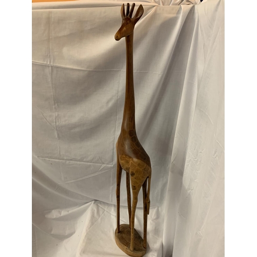 44A - A TALL WOODEN GIRAFFE (REPAIR TO FOOT)