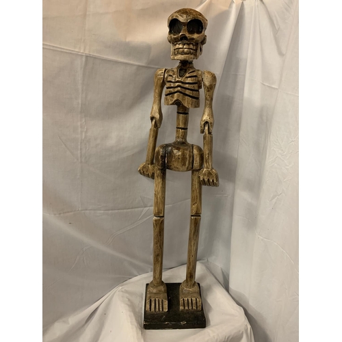 48 - A TALL WOODEN CARVED SKELETON FIGURINE H:114CM