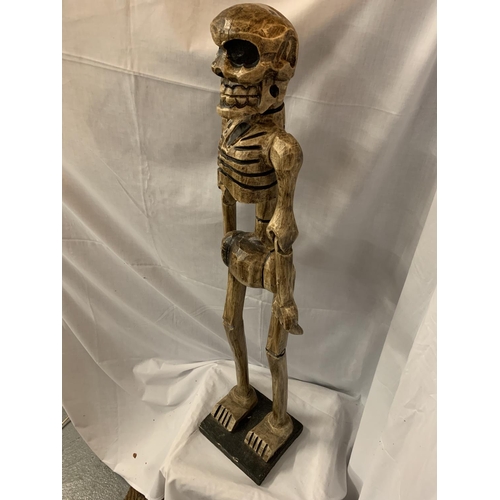 48 - A TALL WOODEN CARVED SKELETON FIGURINE H:114CM