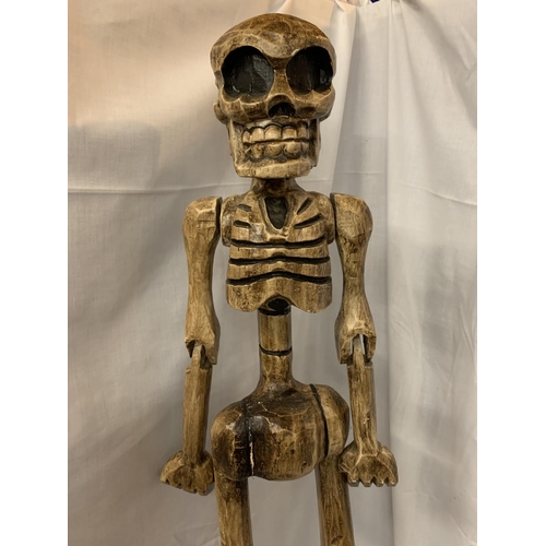 48 - A TALL WOODEN CARVED SKELETON FIGURINE H:114CM