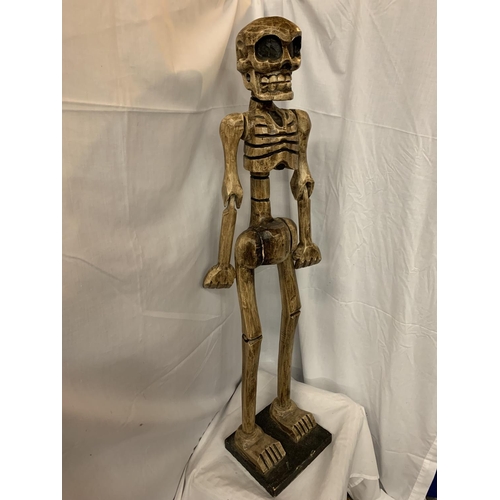 48 - A TALL WOODEN CARVED SKELETON FIGURINE H:114CM