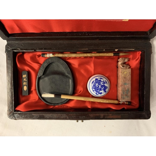 61 - A BOXED ORIENTAL PRINTING SET