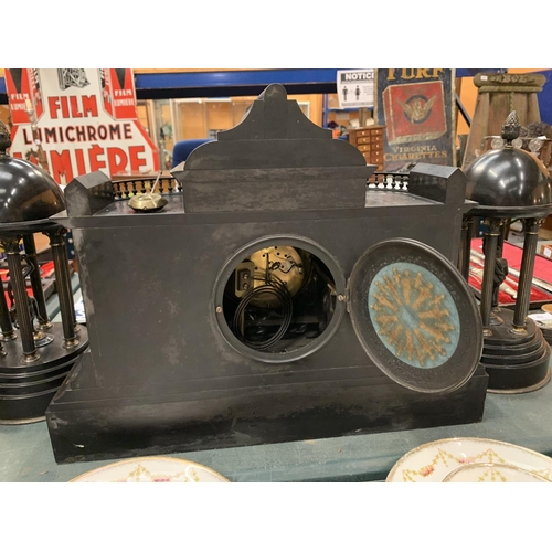 64 - A LARGE DECORATIVE POLISHED SLATE OVER MANTEL CLOCK WITH EMBOSSED COPPER DEPICTING ROMAN SCENES 50CM... 