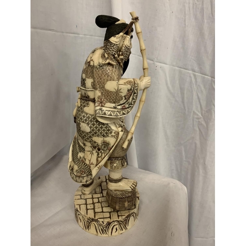 78 - A TALL CARVED BONE JAPANESE MAN FIGURINE