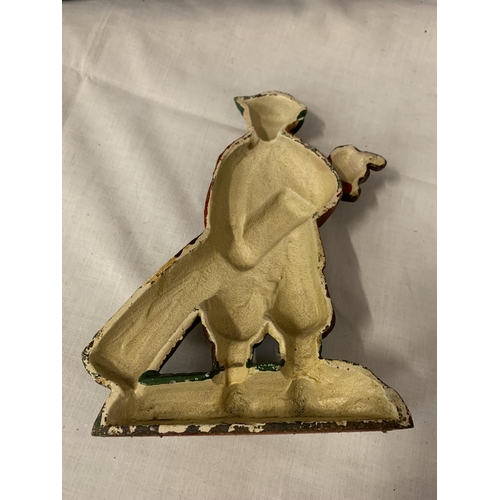 83 - A PAINTED CAST IRON DOOR STOP IN THE SHAPE OF A GOLFER CARRYING HIS CLUBS