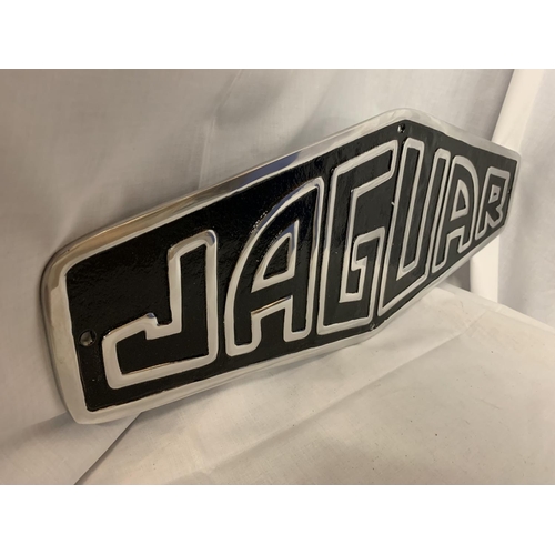 90 - A CHROME AND BLACK JAGUAR SIGN