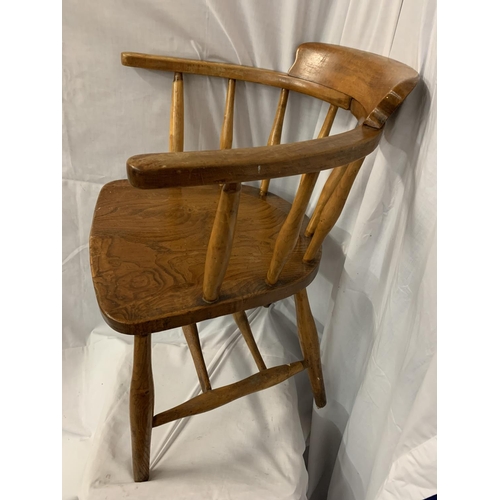 93 - AN OAK CAPTAINS ARMCHAIR