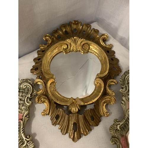 96 - A PAIR OF ORNATE CERAMIC MIRRORS AND A FURTHER GILT FRAMED MIRROR