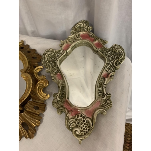 96 - A PAIR OF ORNATE CERAMIC MIRRORS AND A FURTHER GILT FRAMED MIRROR