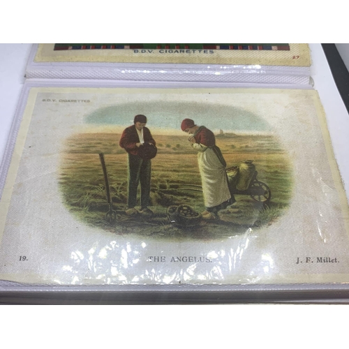 25A - AN ALBUM CONTAINING TWENTY TWO VARIOUS BVD CIGARETTE SILKS