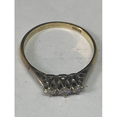 513 - AN 18 CARAT GOLD RING WITH THREE IN LINE STONES POSSIBLY DIAMONDS SIZE O WITH A PRESENTATION BOX