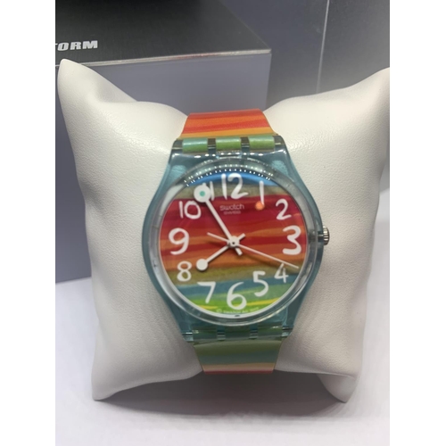 650 - A COLOURFUL SWATCH WATCH IN A PRESENTATION BOX SEEN WORKING BUT NO WARRANTY