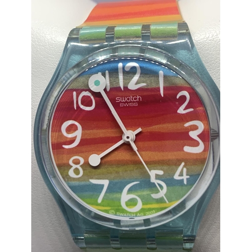 650 - A COLOURFUL SWATCH WATCH IN A PRESENTATION BOX SEEN WORKING BUT NO WARRANTY