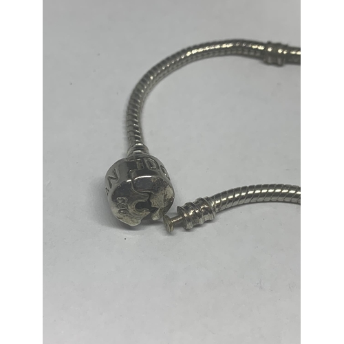 651 - A PANDORA BRACELET WITH A CHARM IN A PRESENTATION BOX