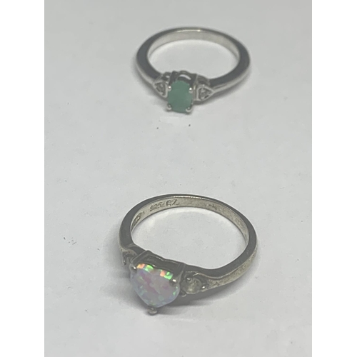 655 - FIVE SILVER RINGS TO INCLUDE CLEAR, GREEN AND OPAL STONE EXAMPLES