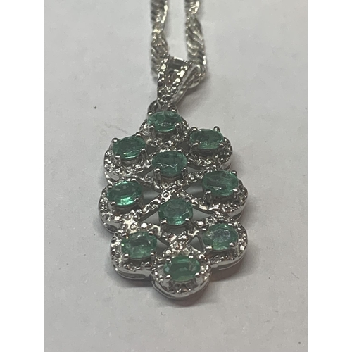 657 - TWO SILVER NECKLACES WITH GREEN STONE PENDANTS