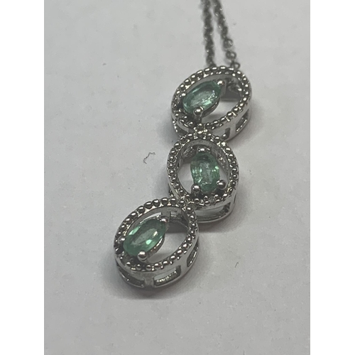 657 - TWO SILVER NECKLACES WITH GREEN STONE PENDANTS