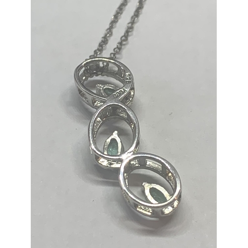 657 - TWO SILVER NECKLACES WITH GREEN STONE PENDANTS