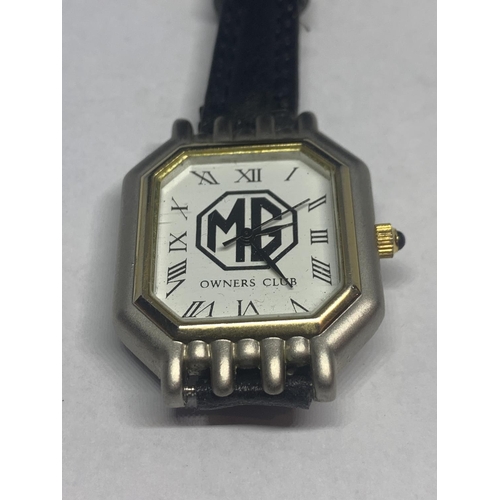 670 - AN MG OWNERS CLUB WRIST WATCH WITH BLACK LEATHER STRAP SEEN WORKING BUT NO WARRANTY