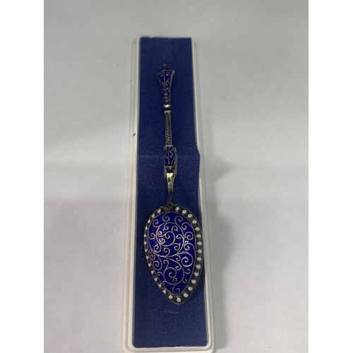 677 - A NORWEGIAN SILVER AND ENAMEL SPOON WITH A MARIUS HAMMER DESIGN