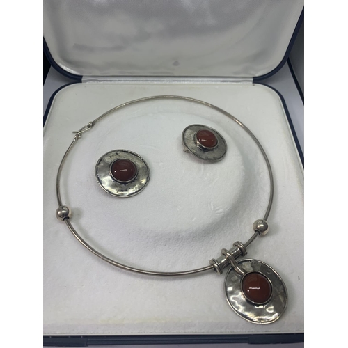 679 - A MARKED 925 SILVER NECKLACE AND EARRINGS SET WITH RED STONES IN A PRESENTATION BOX