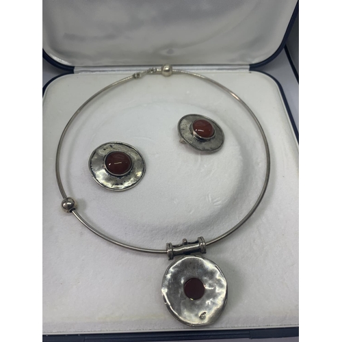 679 - A MARKED 925 SILVER NECKLACE AND EARRINGS SET WITH RED STONES IN A PRESENTATION BOX