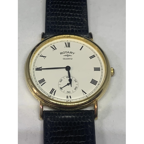 686 - A ROTARY WRIST WATCH WITH BLACK LEATHER STRAP