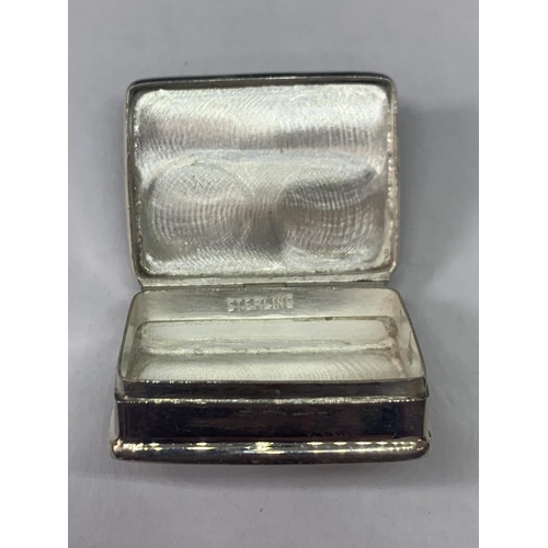 698 - A MARKED SILVER PILL BOX WITH AN EROTIC DESIGN LID