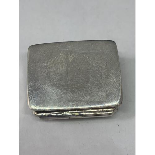 698 - A MARKED SILVER PILL BOX WITH AN EROTIC DESIGN LID