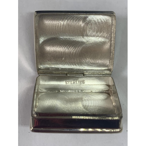 699 - A MARKED SILVER PILL BOX WITH AN EROTIC DESIGN LID