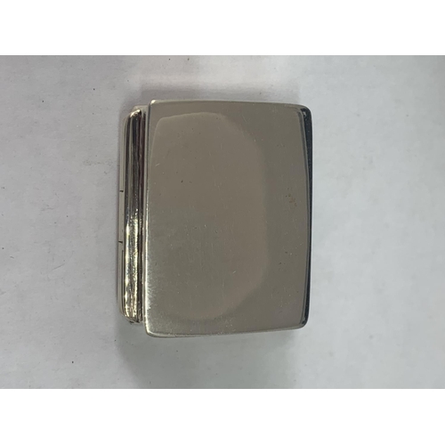 699 - A MARKED SILVER PILL BOX WITH AN EROTIC DESIGN LID