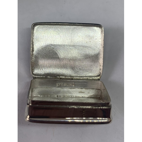 700 - A MARKED SILVER PILL BOX WITH AN EROTIC DESIGN LID