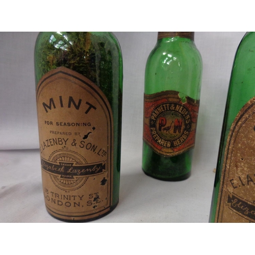 807 - A COLLECTION OF FOUR VINTAGE GREEN GLASS HERB BOTTLES