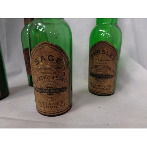 807 - A COLLECTION OF FOUR VINTAGE GREEN GLASS HERB BOTTLES