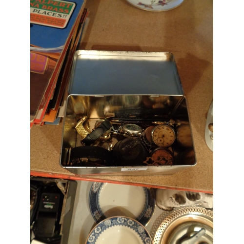 837 - A COLLECTION OF ITEMS TO INCLUDE WATCHES AND SPARES, BRASS BELL ETC IN A TIN