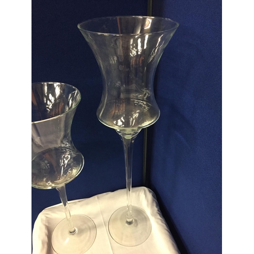 12 - THREE LARGE GLASS CANDLE HOLDERS
APPROXIMATE HEIGHTS 70CM 55CM 40CM