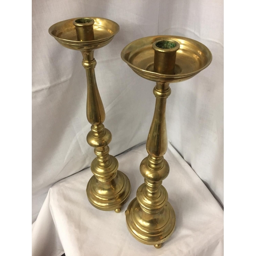 48 - A PAIR OF TALL BRASS CANDLESTICKS
HEIGHT 56CM